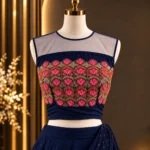 Navy blue lehenga set with vibrant pink floral embroidery,