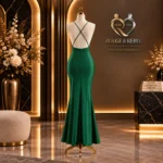 Emerald green satin floor-length gown with cowl neckline, ruched detailing and thigh-high slit